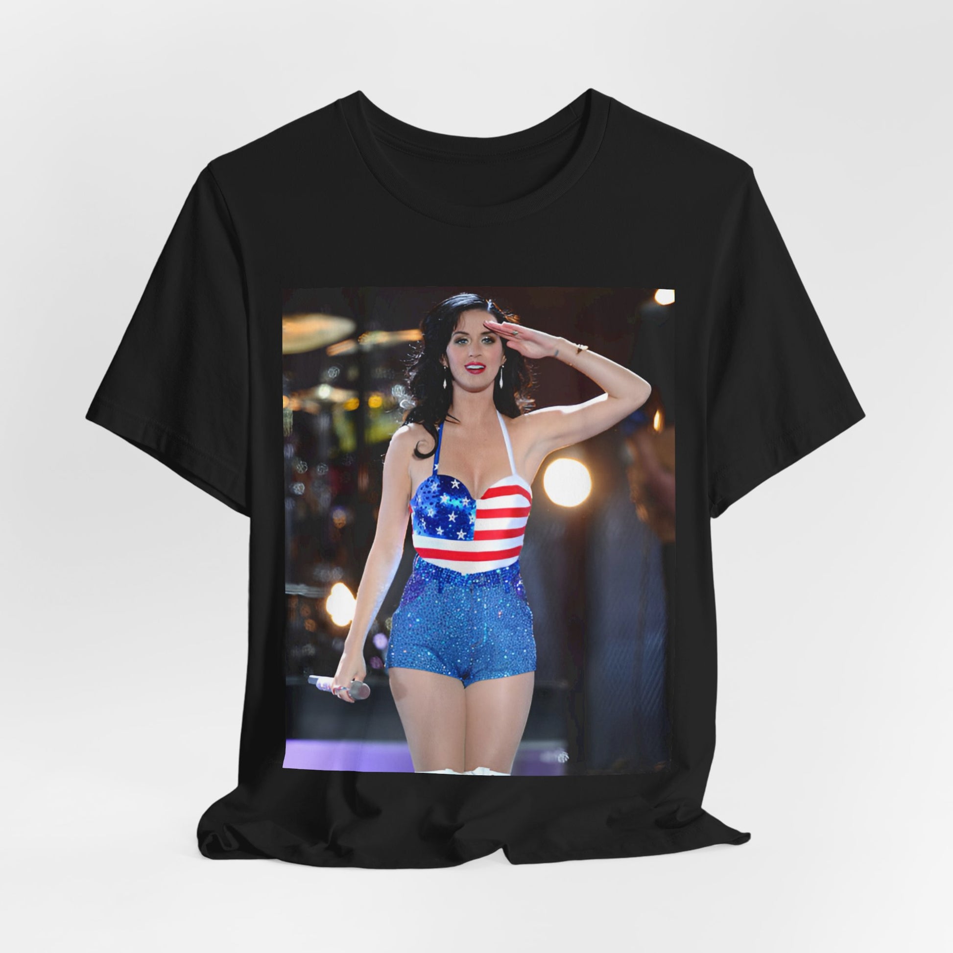 A black graphic t-shirt featuring a vintage graphic related to Katy Perry's 'Firework' song or era.