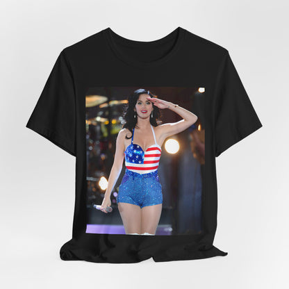 A black graphic t-shirt featuring a vintage graphic related to Katy Perry's 'Firework' song or era.