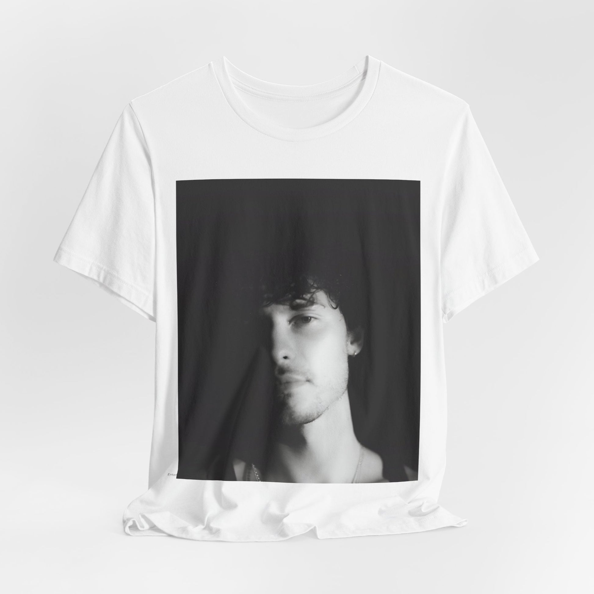 A black graphic t-shirt featuring a black and white portrait photo of Shawn Mendes.