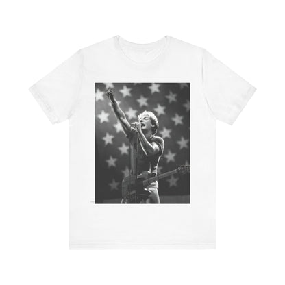 A black graphic t-shirt featuring a 70s era Americana-style graphic of Bruce Springsteen.