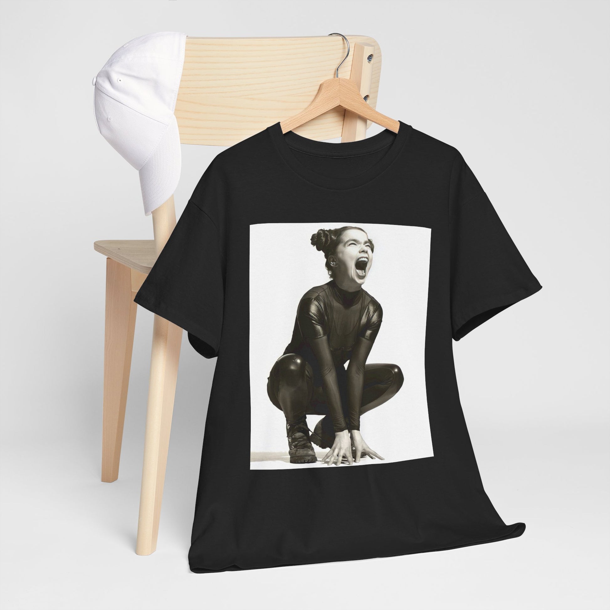 A black graphic t-shirt featuring a 90s black and white graphic of Bjork with a rebellious or edgy pose.