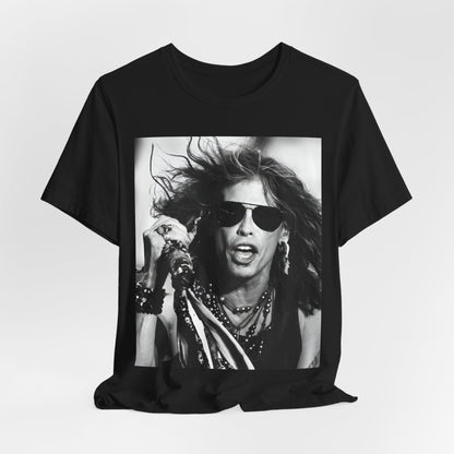 A black graphic t-shirt featuring a black and white photo of Aerosmith's Steven Tyler with his signature scarf and microphone, captured during a dynamic performance.
