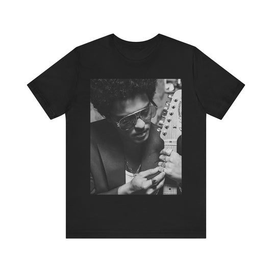 A black graphic t-shirt featuring a graphic of Bruno Mars in a classic crooner style.