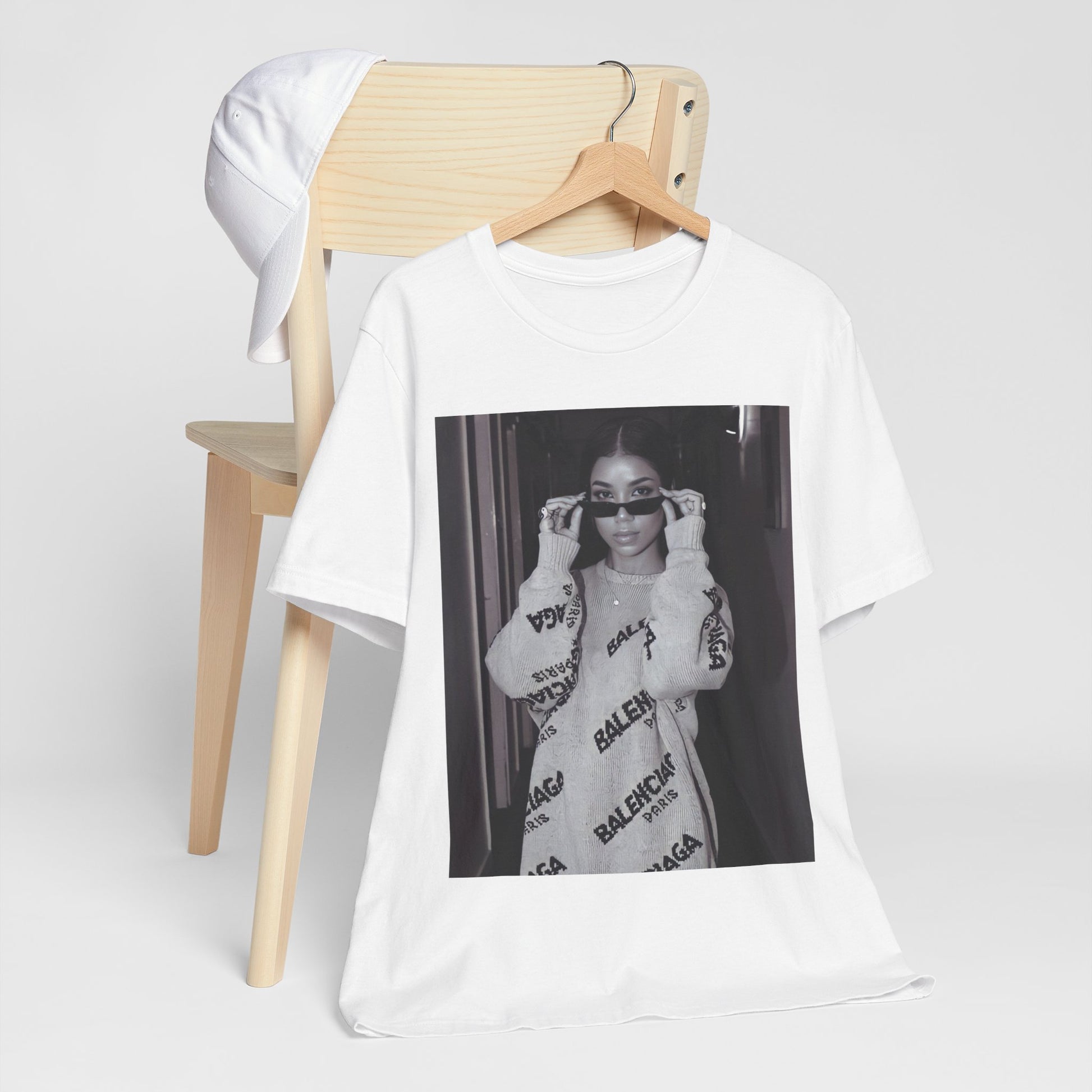 A black graphic t-shirt featuring a black and white, monochrome graphic or photo of Jhene Aiko.