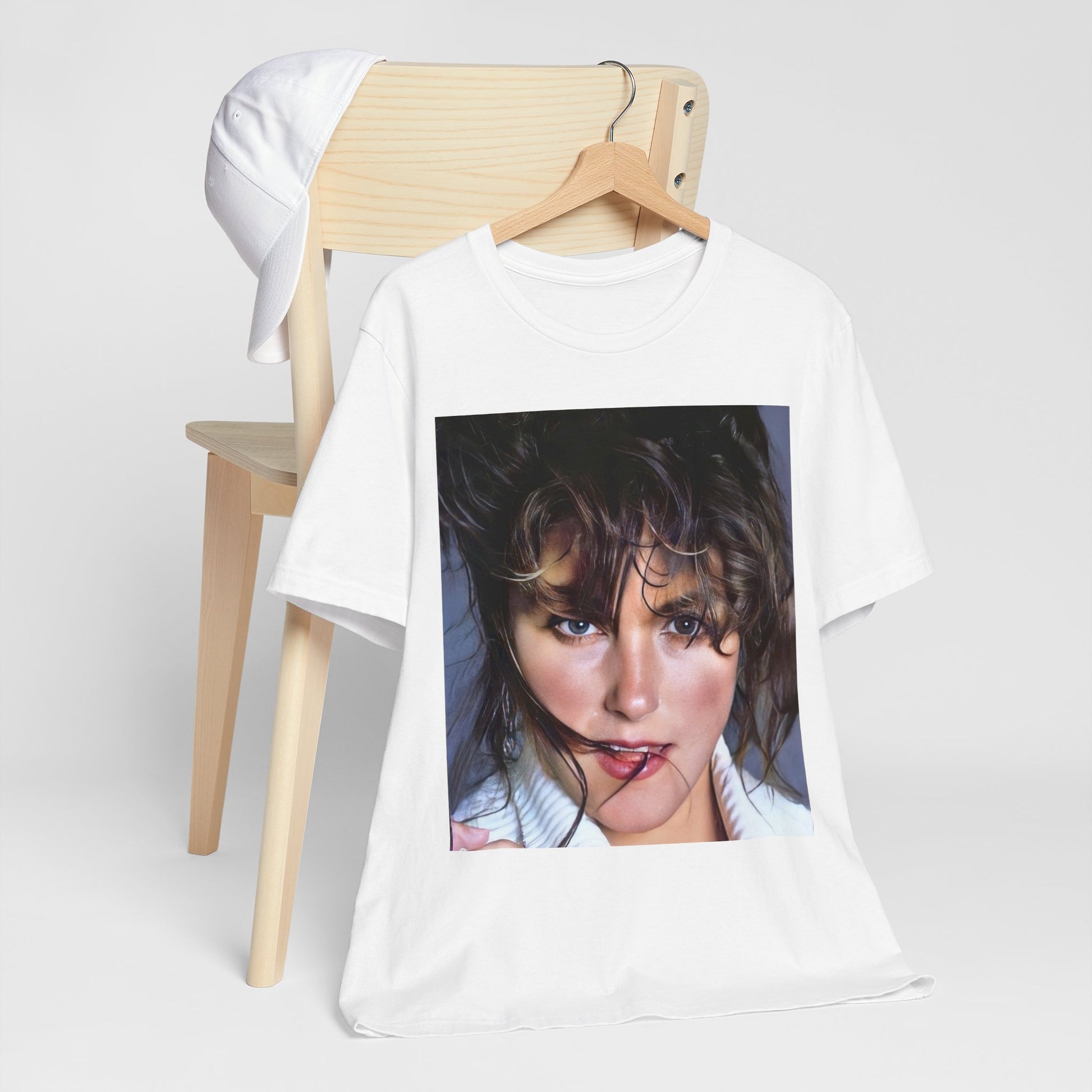 A black graphic t-shirt featuring an 80s style graphic of Laura Branigan.