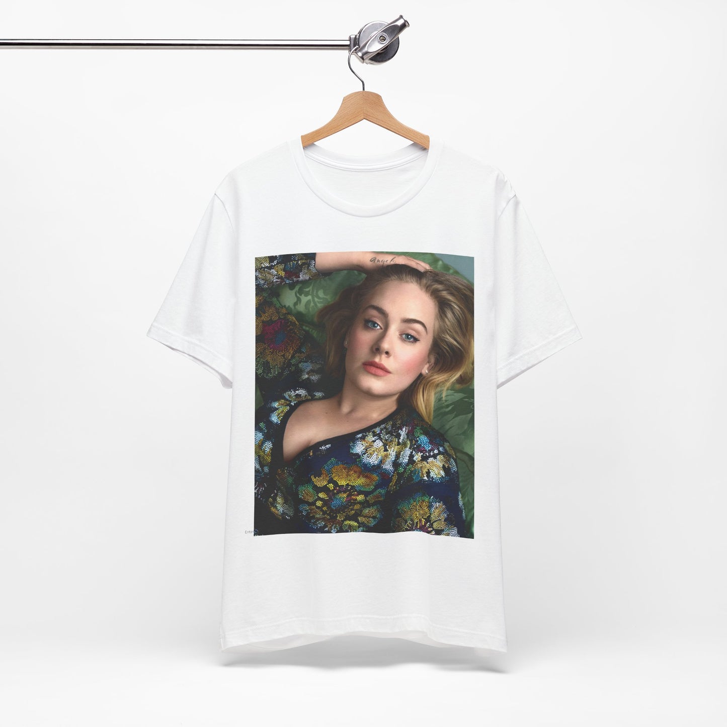 A black graphic t-shirt featuring a photo of Adele, possibly with floral elements or a floral background, showing a serene or contemplative expression.