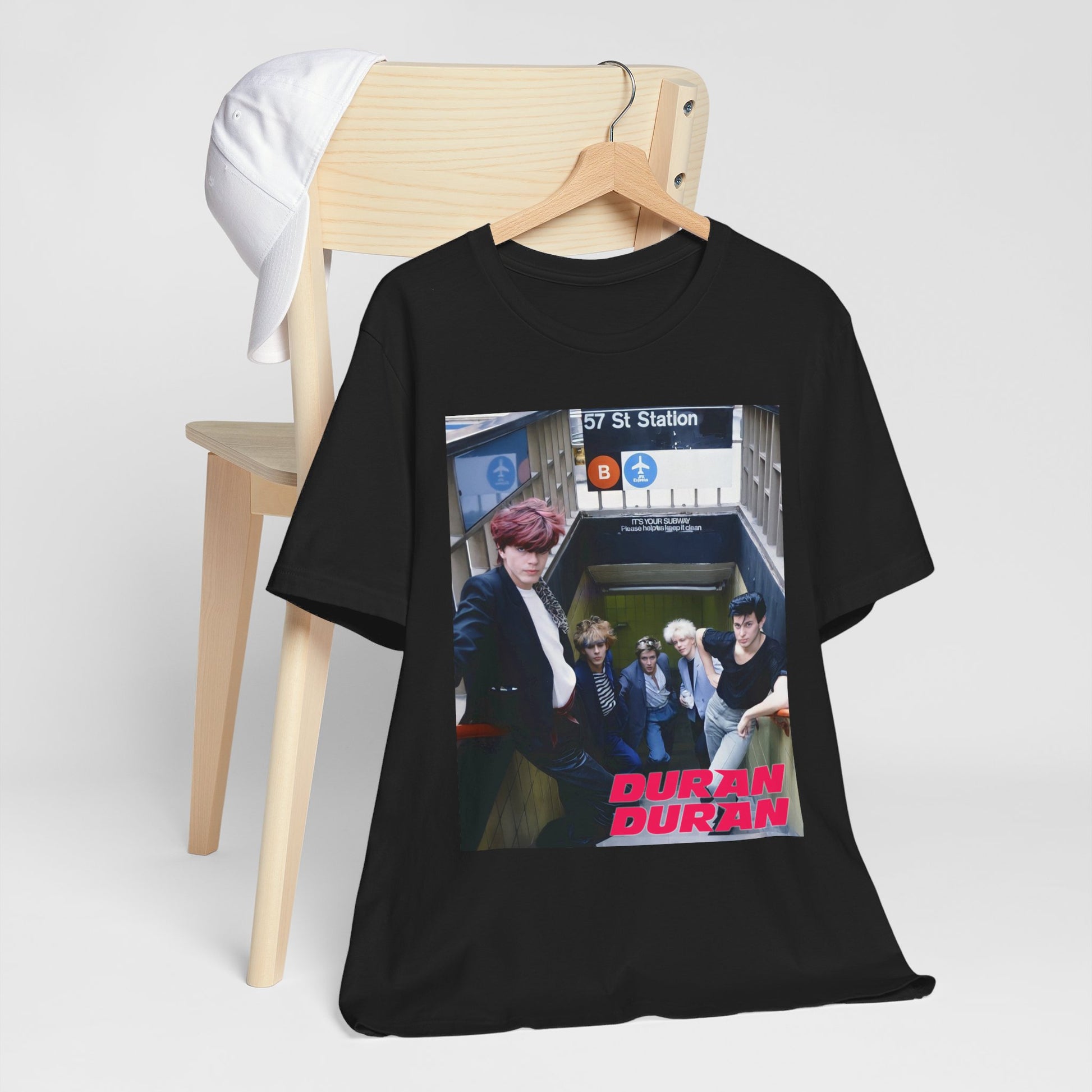 A black graphic t-shirt featuring an 80s photo of Duran Duran in a subway station.