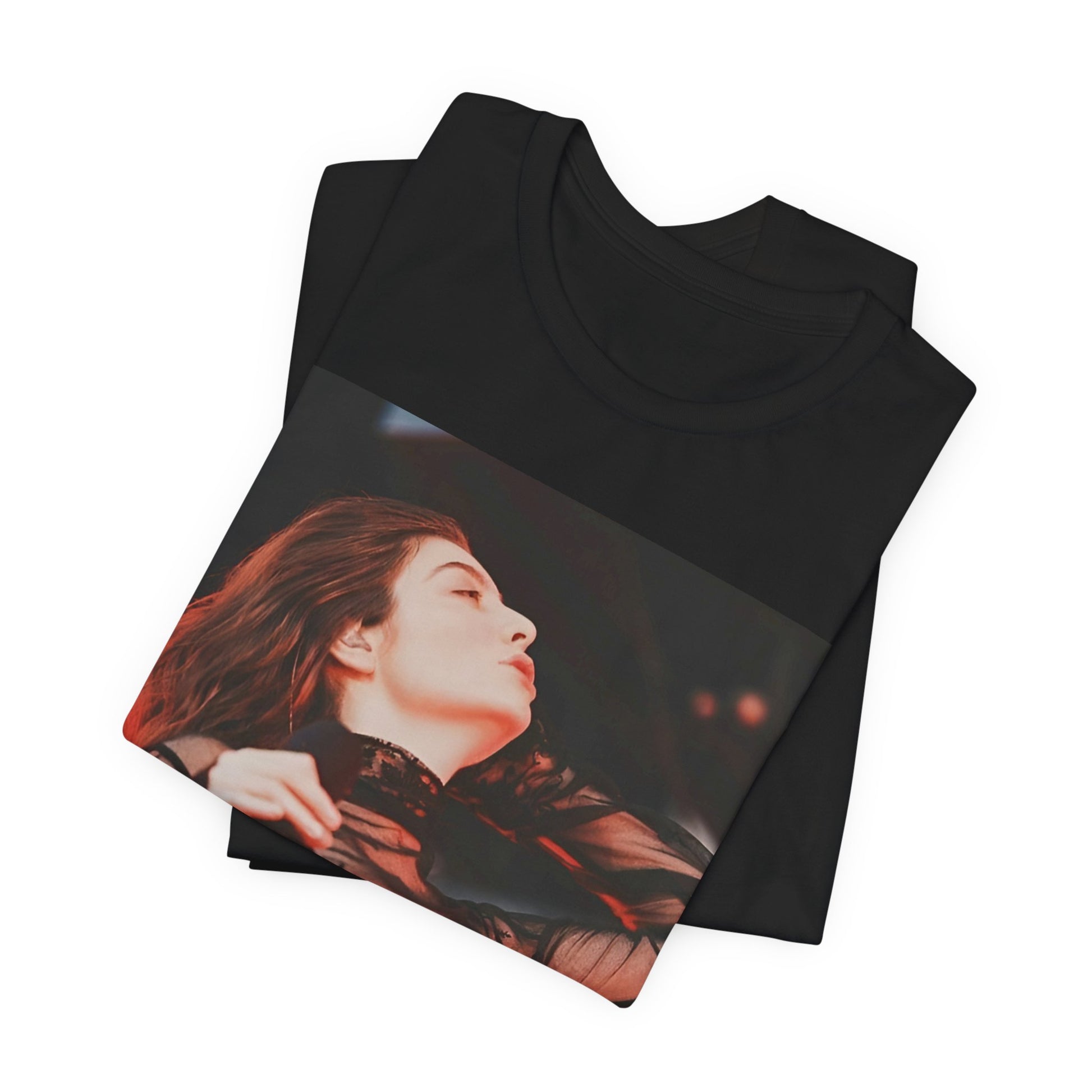 A black graphic t-shirt featuring a graphic of Lorde emphasizing raw emotion.