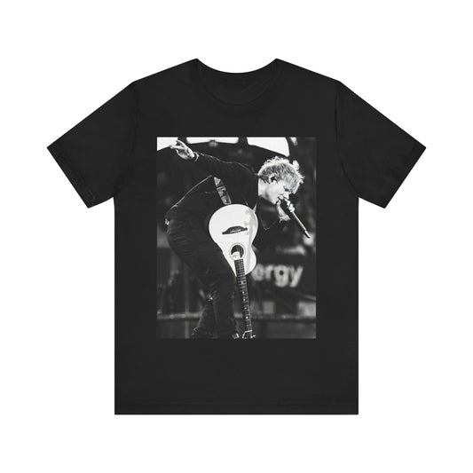 A black graphic t-shirt featuring a vintage graphic of Ed Sheeran performing live.