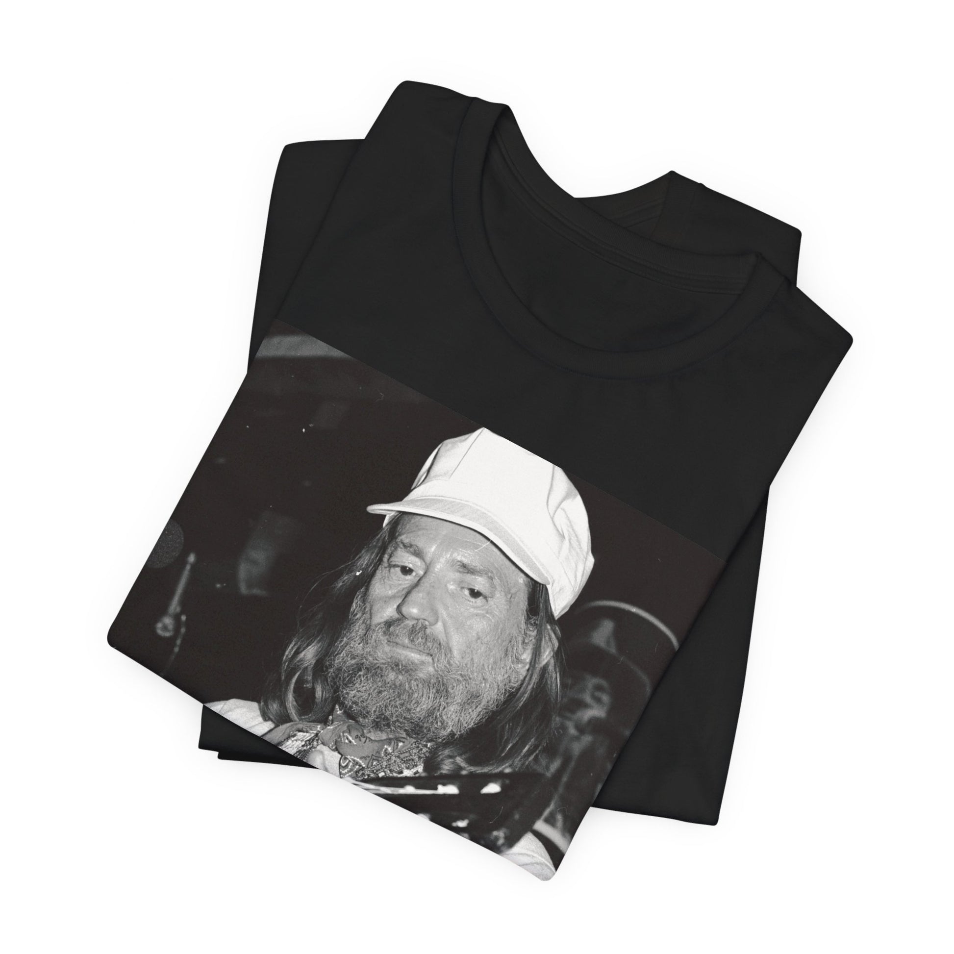 A black graphic t-shirt featuring a 70s cool free spirit graphic of Willie Nelson.