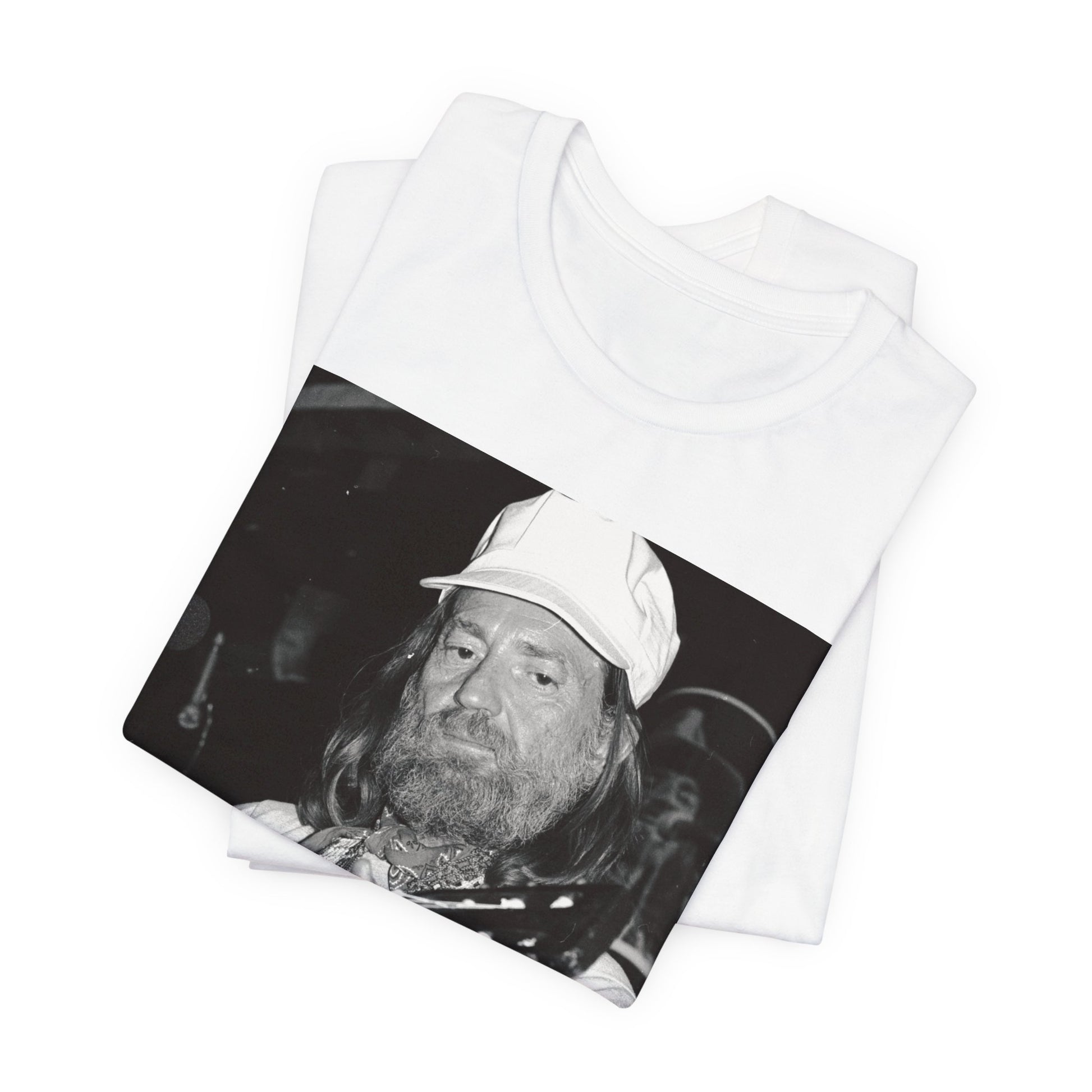 A black graphic t-shirt featuring a 70s cool free spirit graphic of Willie Nelson.