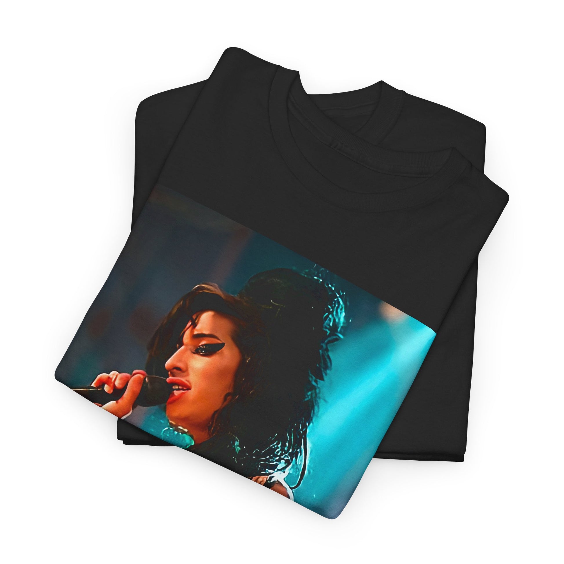 A black graphic t-shirt featuring a photo of Amy Winehouse performing live on stage in 2007, with her signature beehive and expressive singing.