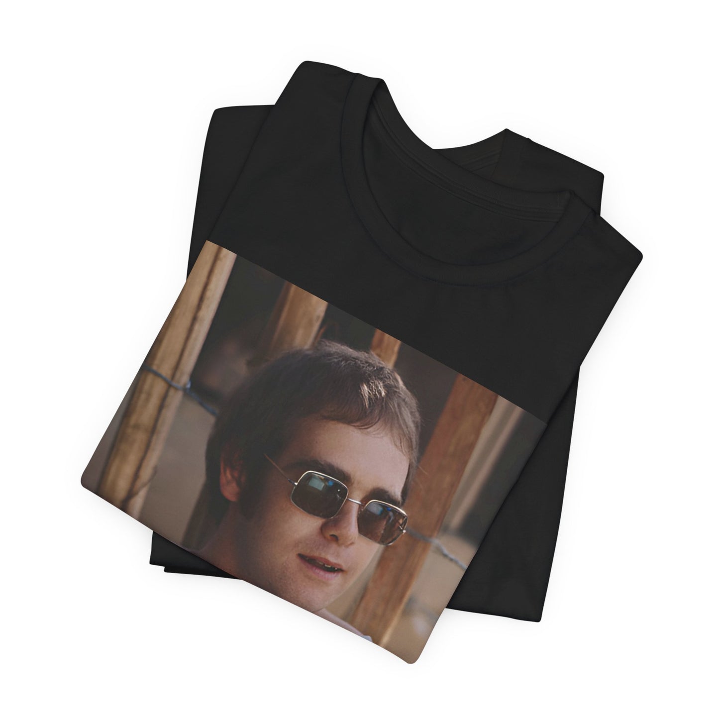 A black graphic t-shirt featuring a classic graphic related to Elton John's 'Tiny Dancer' song or era.