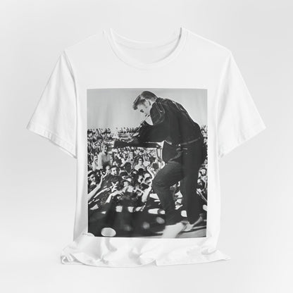 A black graphic t-shirt featuring a retro photo of Elvis Presley performing live in concert in the 1950s.