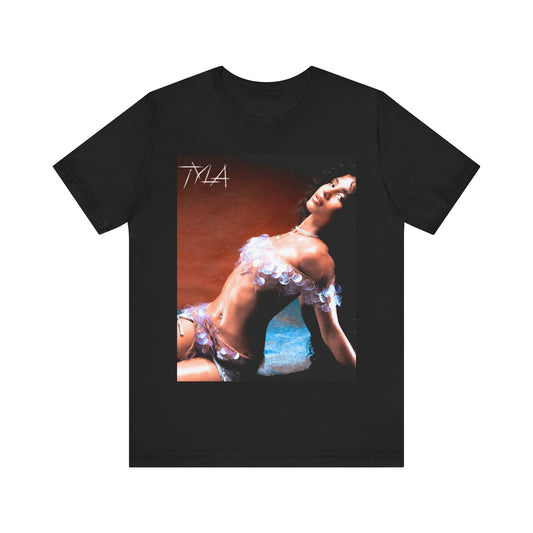 A black graphic t-shirt featuring a cultural fusion vibes graphic of Tyla.