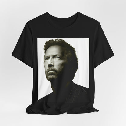 A black graphic t-shirt featuring a retro black and white portrait photo of Eric Clapton.