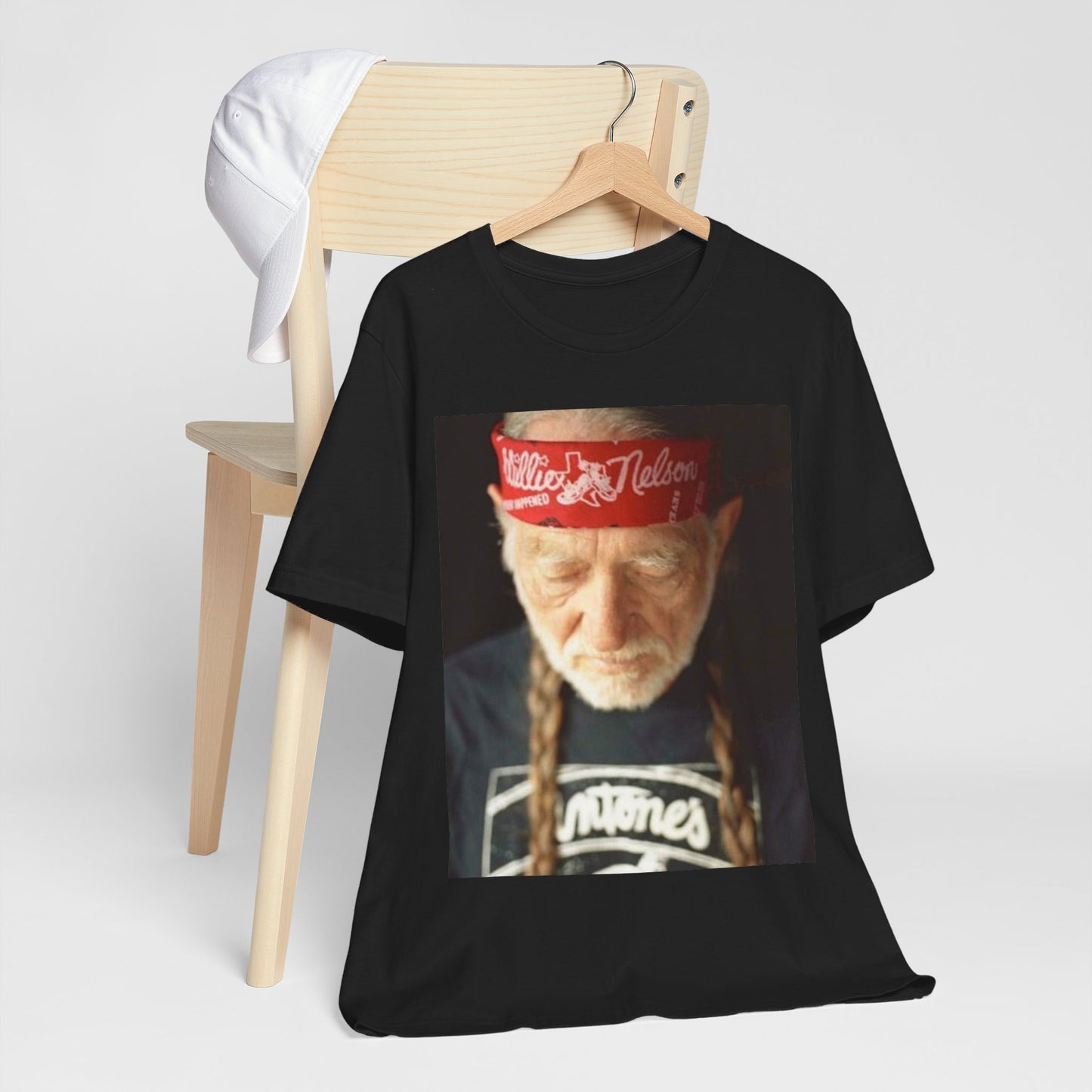 A black graphic t-shirt featuring a Texas music aesthetic graphic of Willie Nelson.