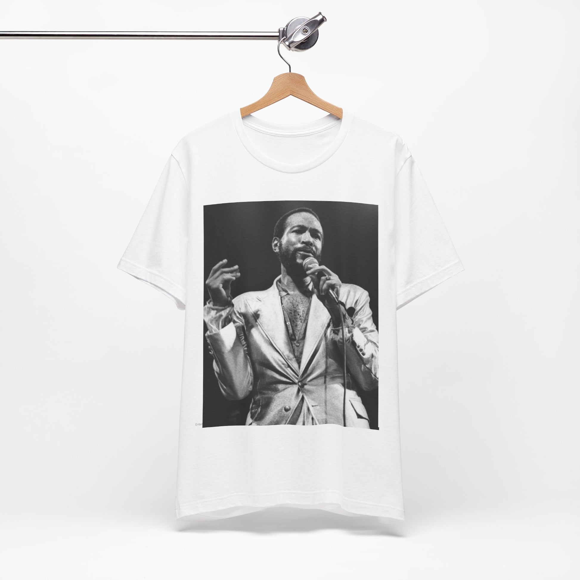 A black graphic t-shirt featuring a retro black and white photo or graphic of Marvin Gaye performing live on stage.