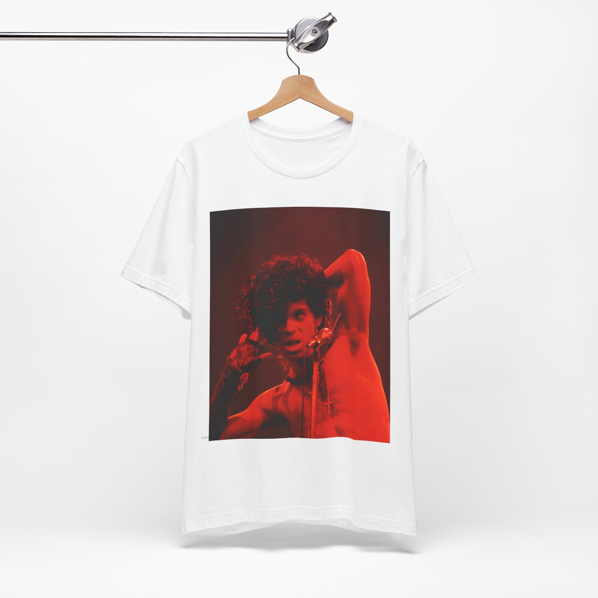 A black graphic t-shirt featuring a concert pop fan graphic of Prince.
