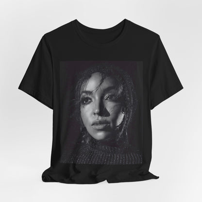A black graphic t-shirt featuring a black and white portrait photo of Tinashe.