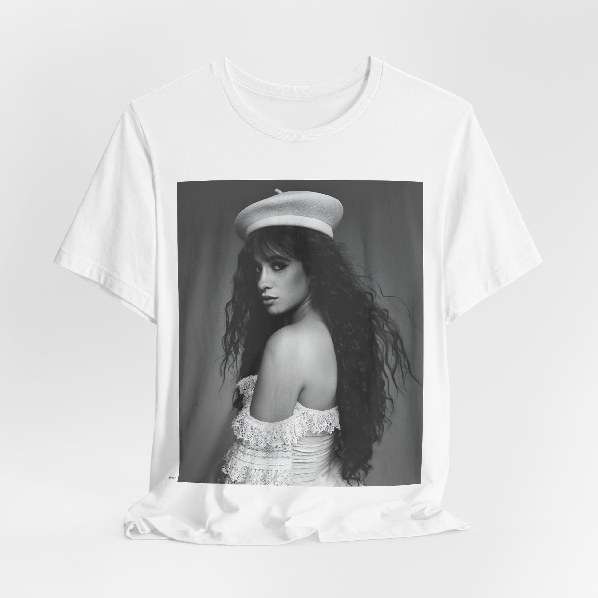 A black graphic t-shirt featuring a black and white graphic of Camila Cabello as a fierce Latina pop star.