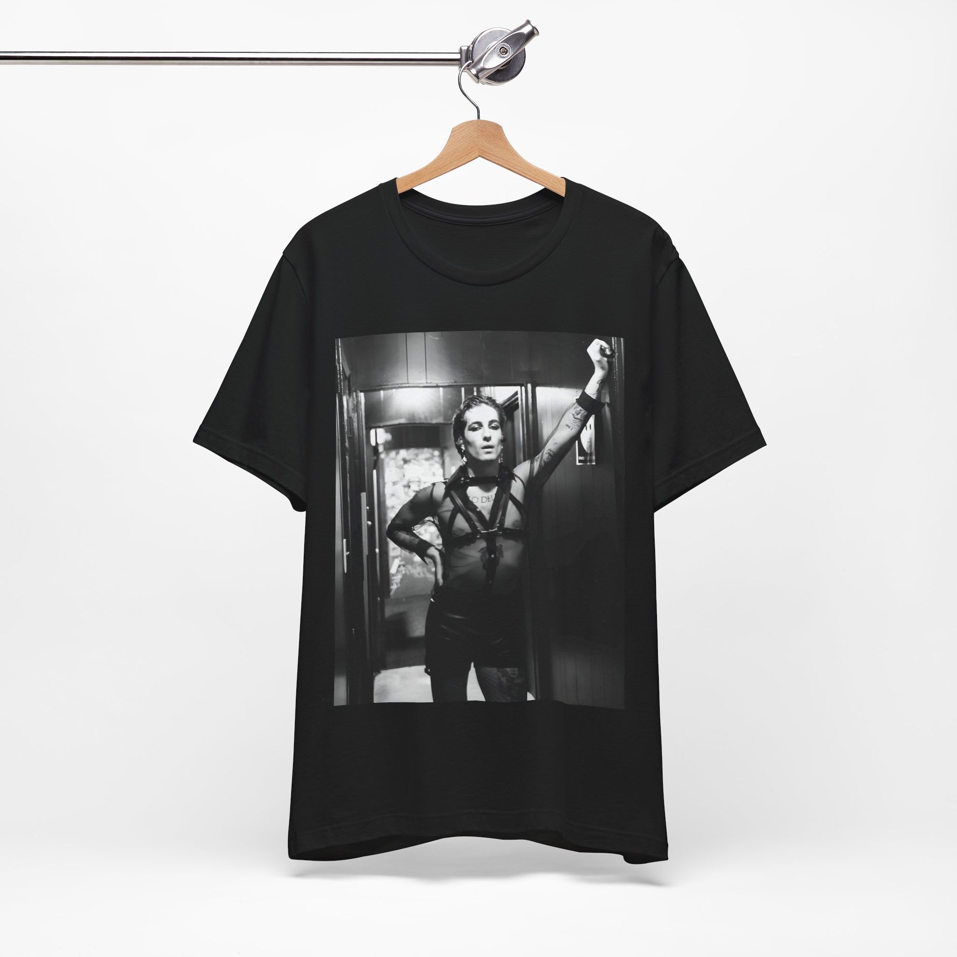 A black graphic t-shirt featuring a graphic of Maneskin emphasizing a rebel rock spirit.