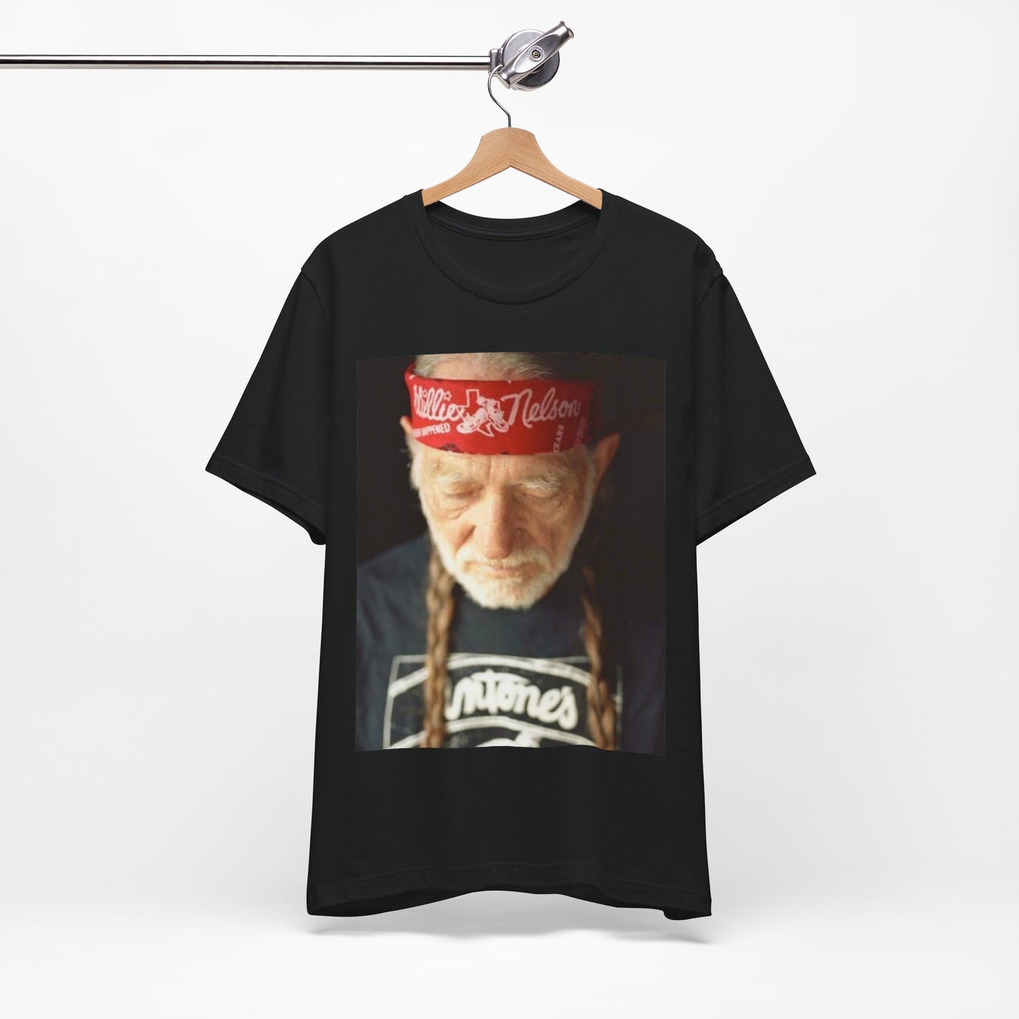 A black graphic t-shirt featuring a Texas music aesthetic graphic of Willie Nelson.