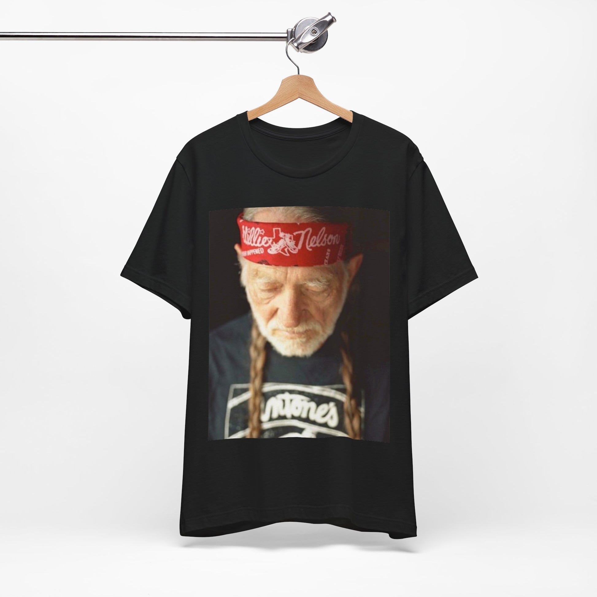 A black graphic t-shirt featuring a Texas music aesthetic graphic of Willie Nelson.