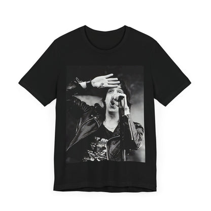 A black graphic t-shirt featuring a black and white portrait photo of The Strokes band.