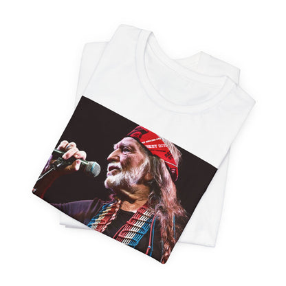 A black graphic t-shirt featuring a graphic of Willie Nelson with his iconic long hair and bandana.