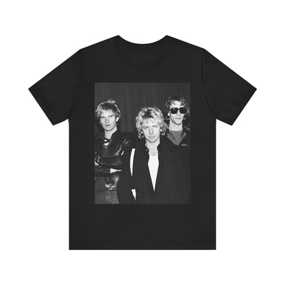 A black graphic t-shirt featuring a black and white, monochrome graphic or photo of The Police.