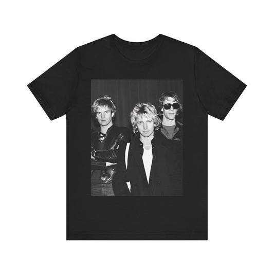 A black graphic t-shirt featuring a black and white, monochrome graphic or photo of The Police.
