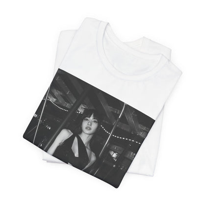A black graphic t-shirt featuring a black and white graphic or photo of Lisa in a backstage setting.