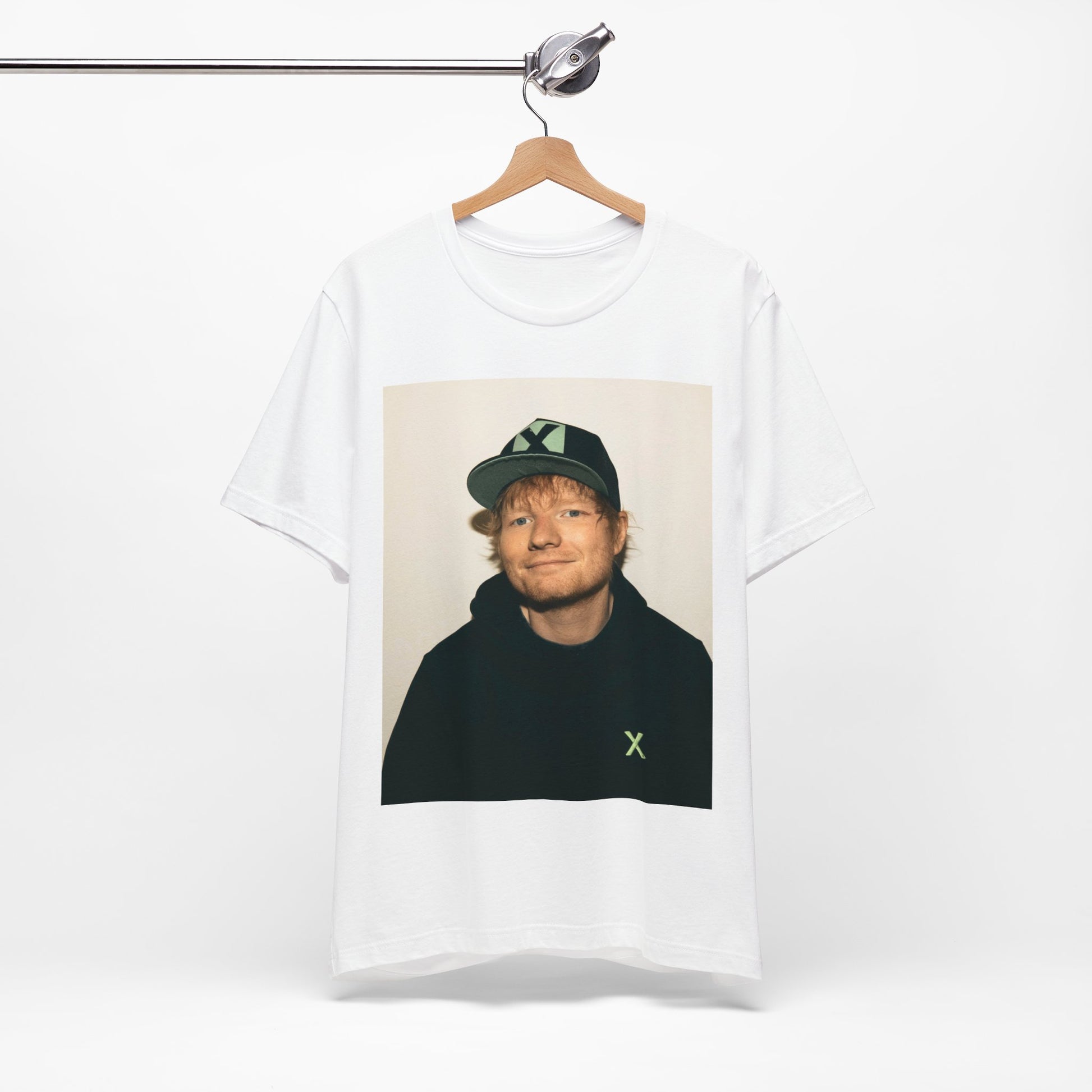 A black graphic t-shirt featuring a glamorous graphic of Ed Sheeran as a global tour icon.