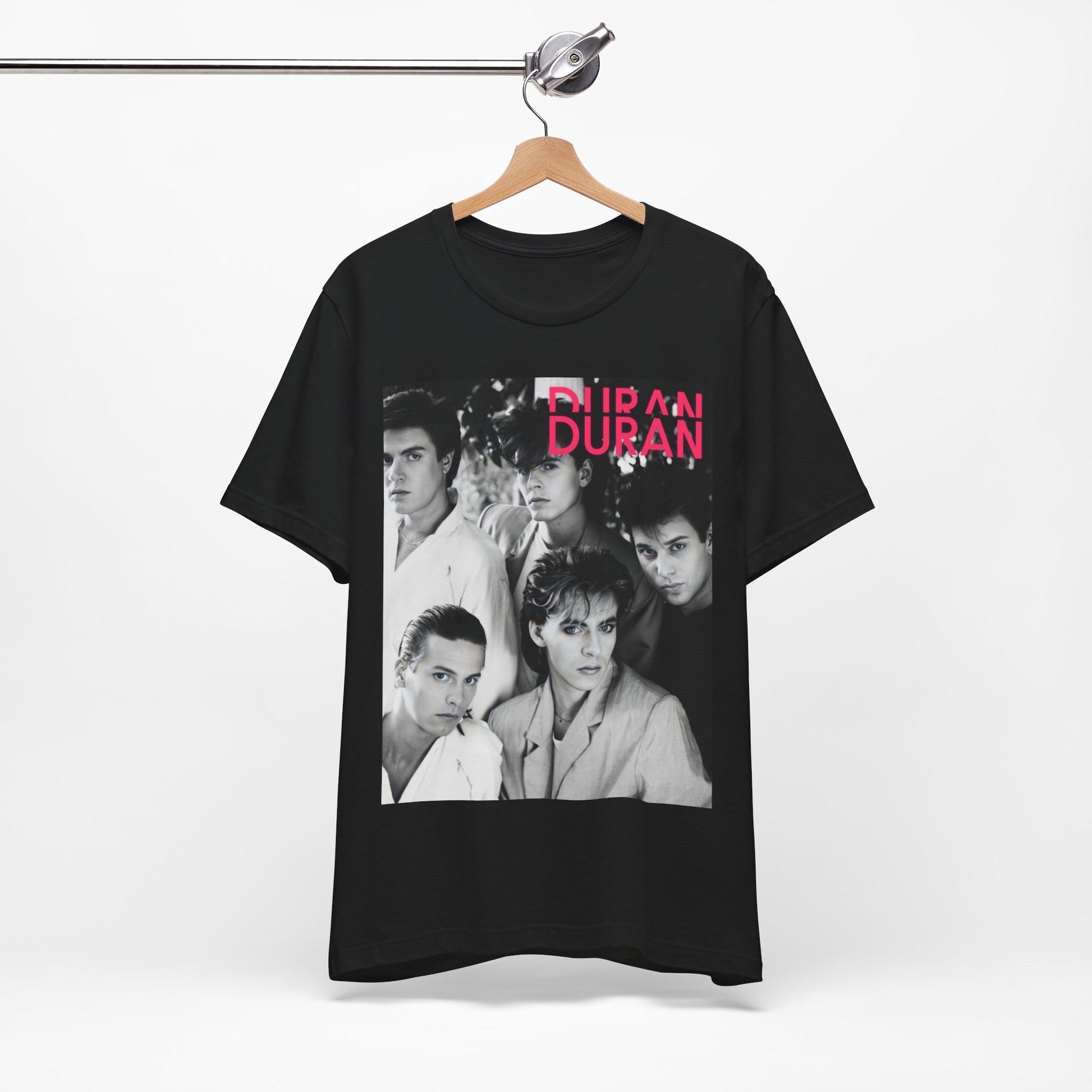 A black graphic t-shirt featuring a black and white graphic or photo of Duran Duran, designed with an 80s retro aesthetic.