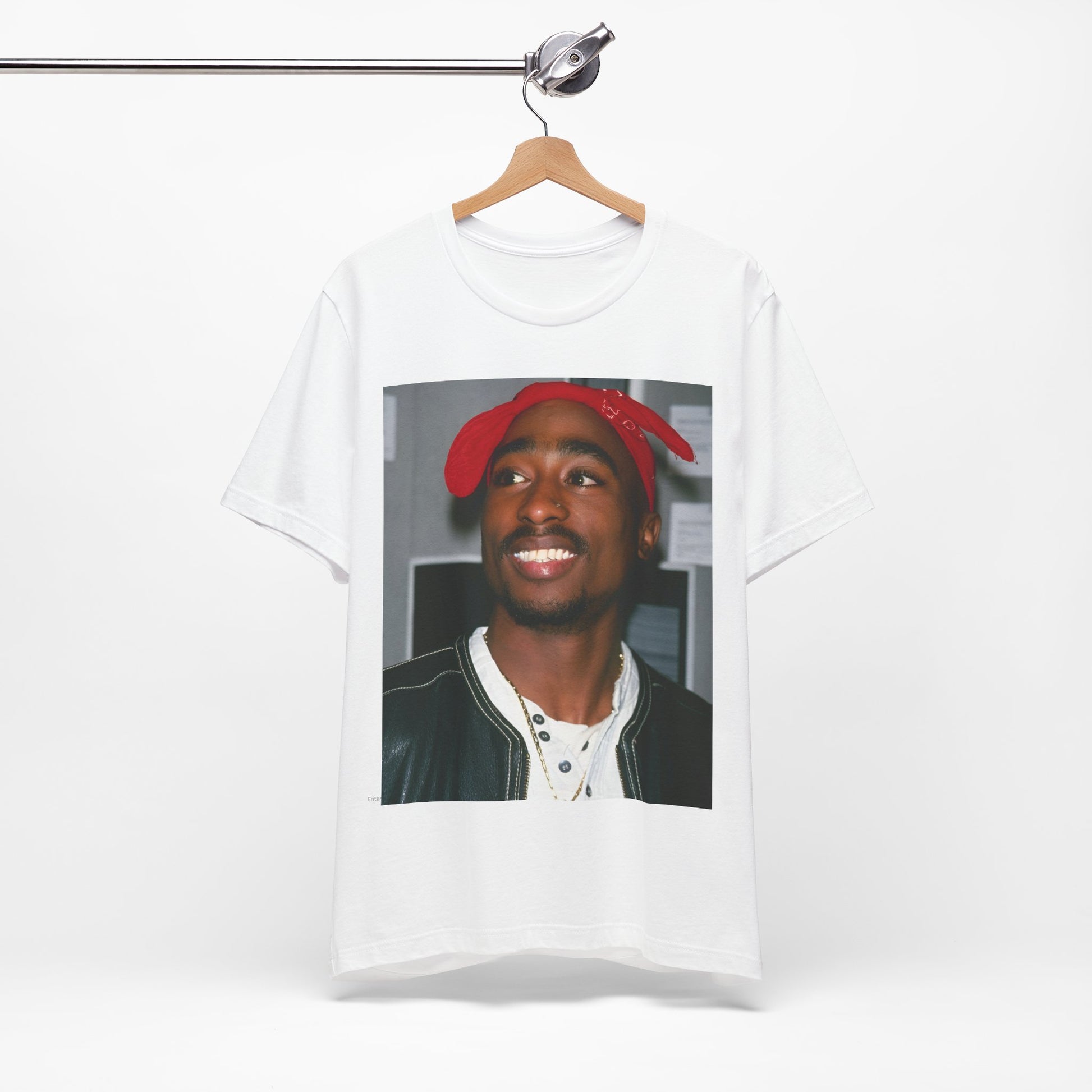 A black graphic t-shirt featuring a graphic of Tupac with his iconic bandana style.