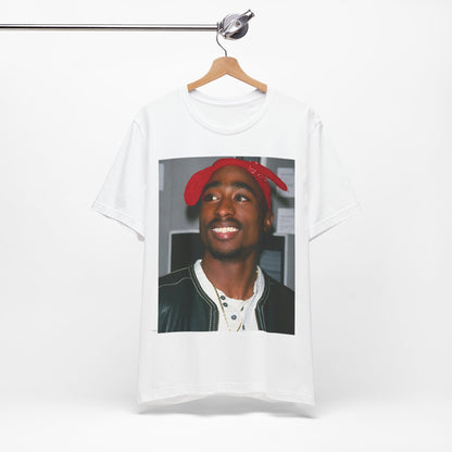 A black graphic t-shirt featuring a graphic of Tupac with his iconic bandana style.