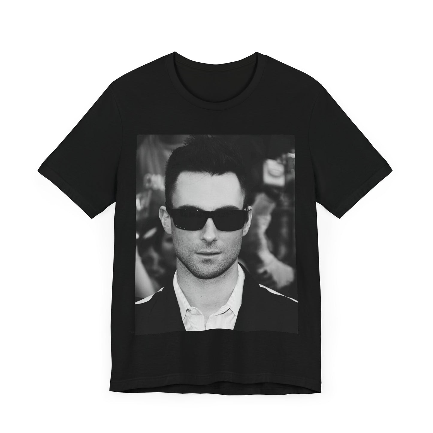 A black and white high-fashion photoshoot photo of Adam Levine, frontman of Maroon 5, looking confidently at the camera.
