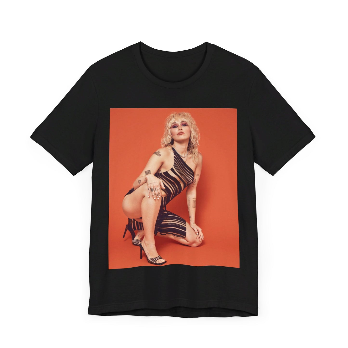 A black graphic t-shirt featuring a casual pop fan graphic of Miley Cyrus.