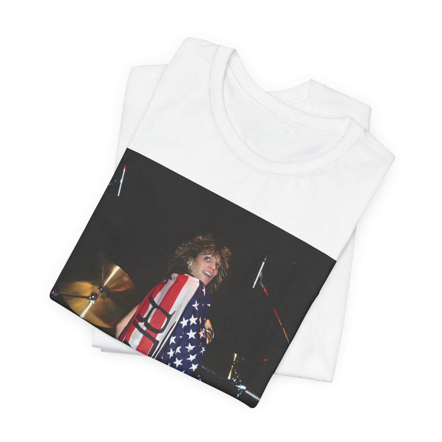 A black graphic t-shirt featuring a graphic of Bon Jovi performing on stage with an American flag as a backdrop.
