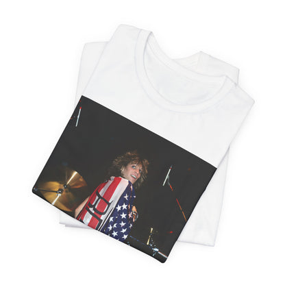 A black graphic t-shirt featuring a graphic of Bon Jovi performing on stage with an American flag as a backdrop.