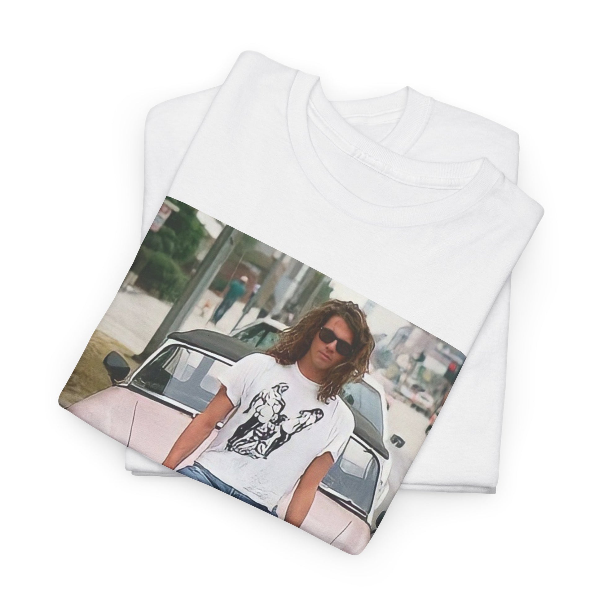 A black graphic t-shirt featuring a vintage photo of INXS band members with a classic car.