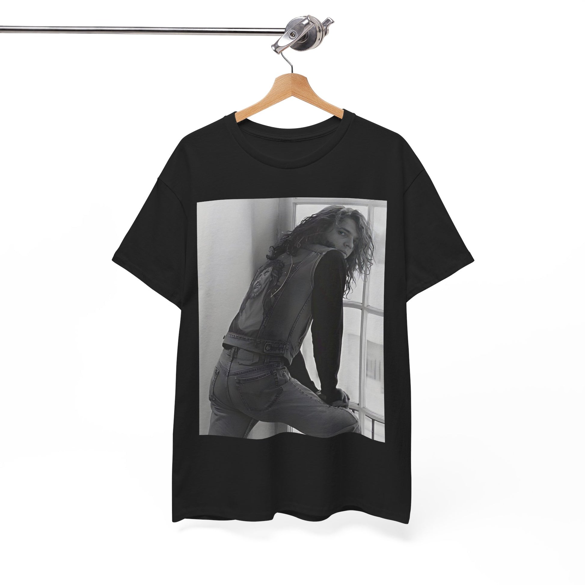 A black graphic t-shirt featuring a 90s black and white photo portrait of Michael Hutchence from INXS.