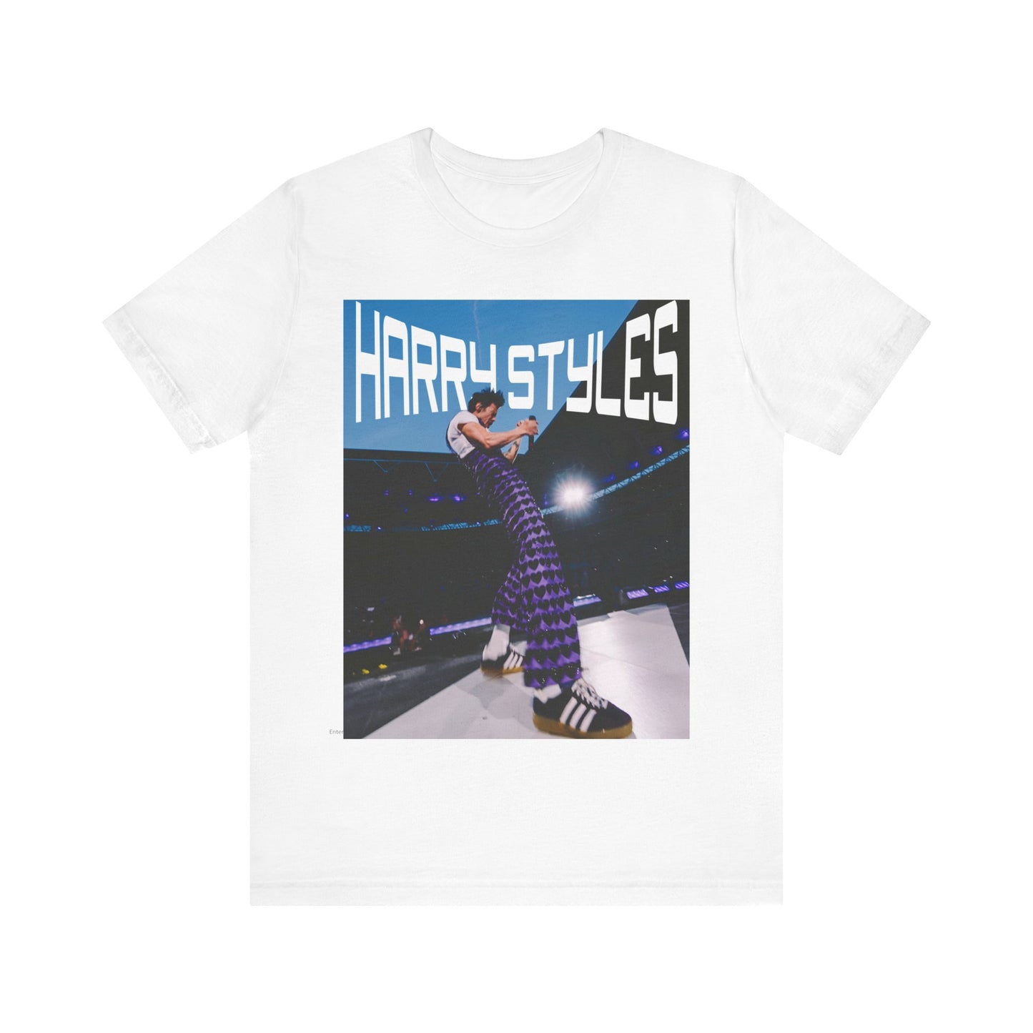 A black graphic t-shirt featuring a graphic or photo of Harry Styles performing live in concert.