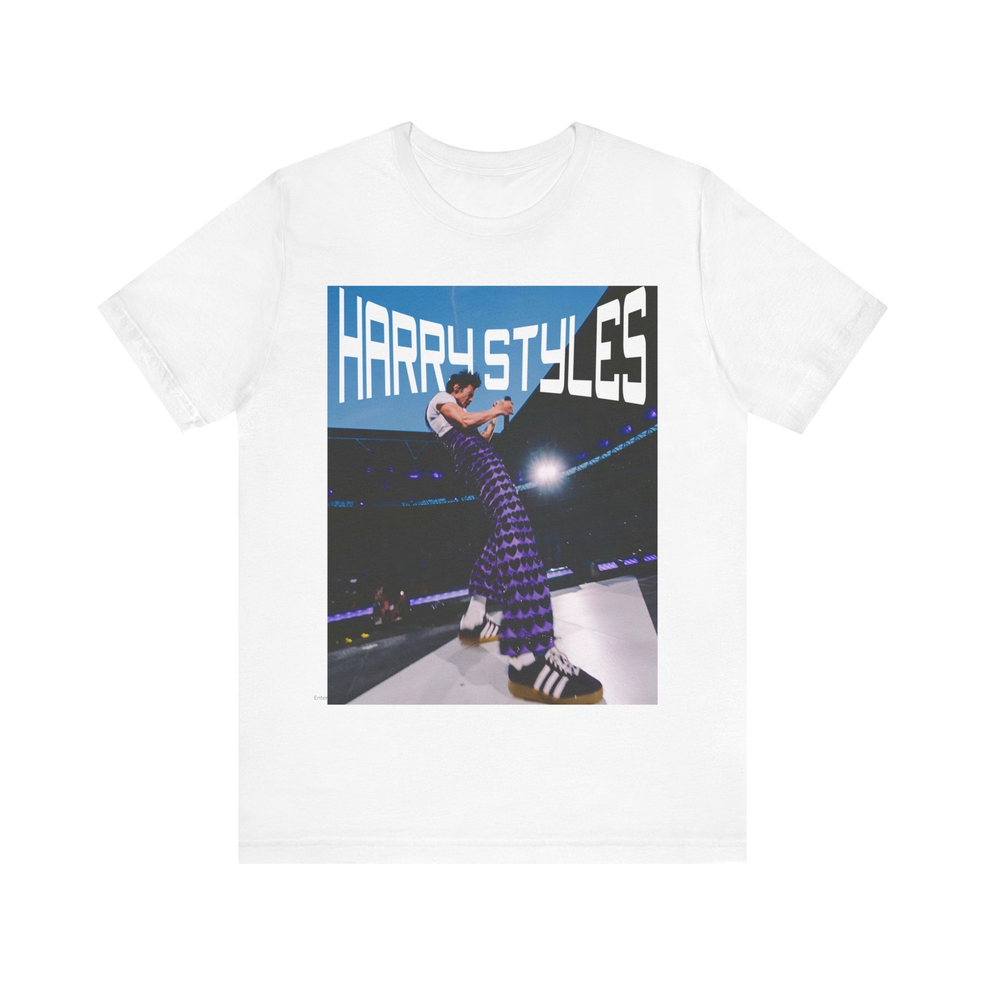 A black graphic t-shirt featuring a graphic or photo of Harry Styles performing live in concert.