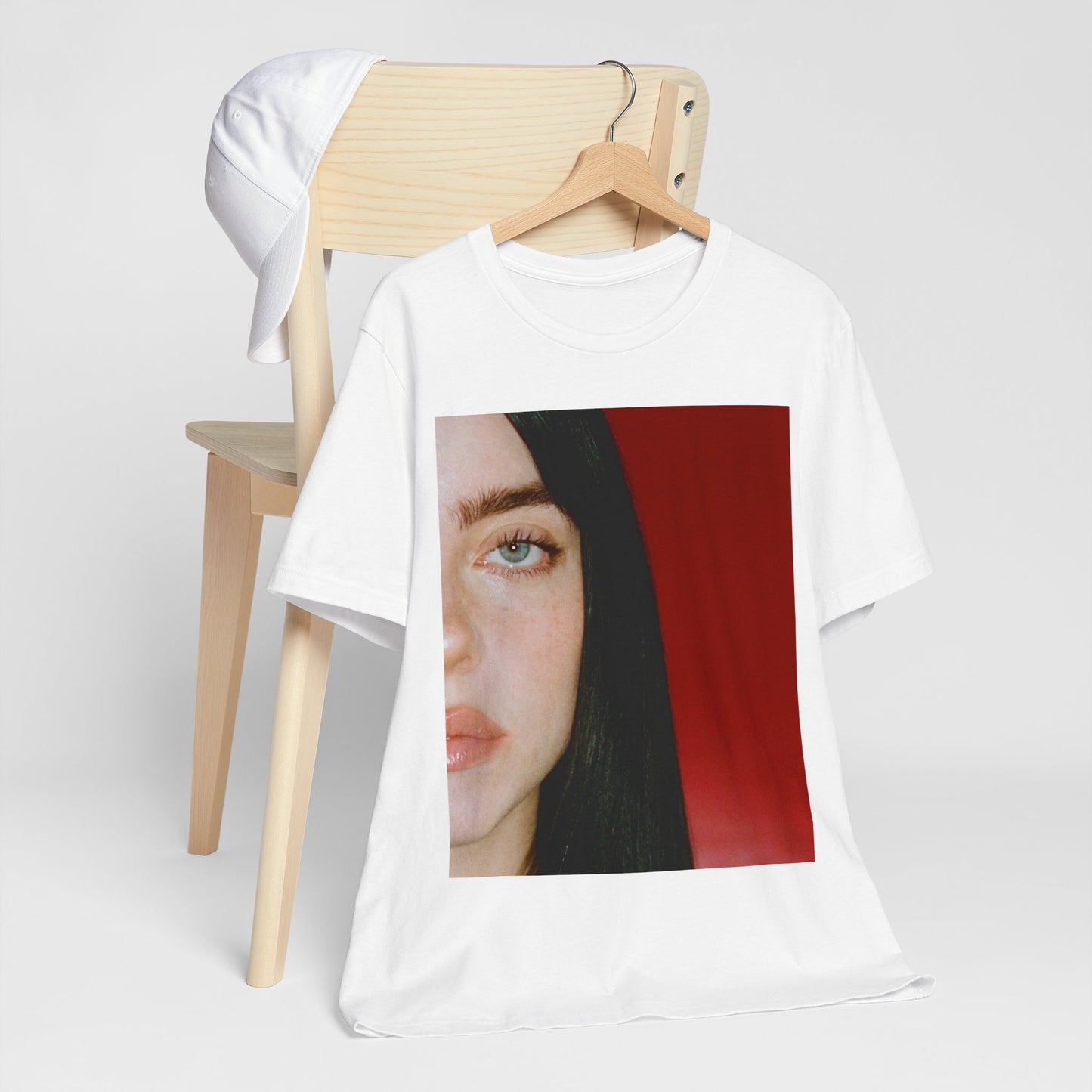 A classic, direct, black and white portrait of Billie Eilish, embodying a timeless aesthetic, printed on a graphic t-shirt.