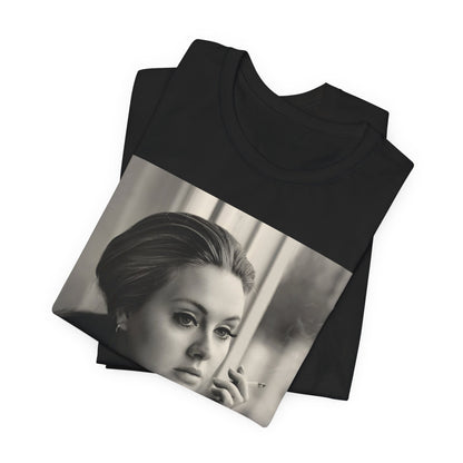 A black graphic t-shirt featuring a black and white photo of Adele, showing her with a serene or thoughtful expression.