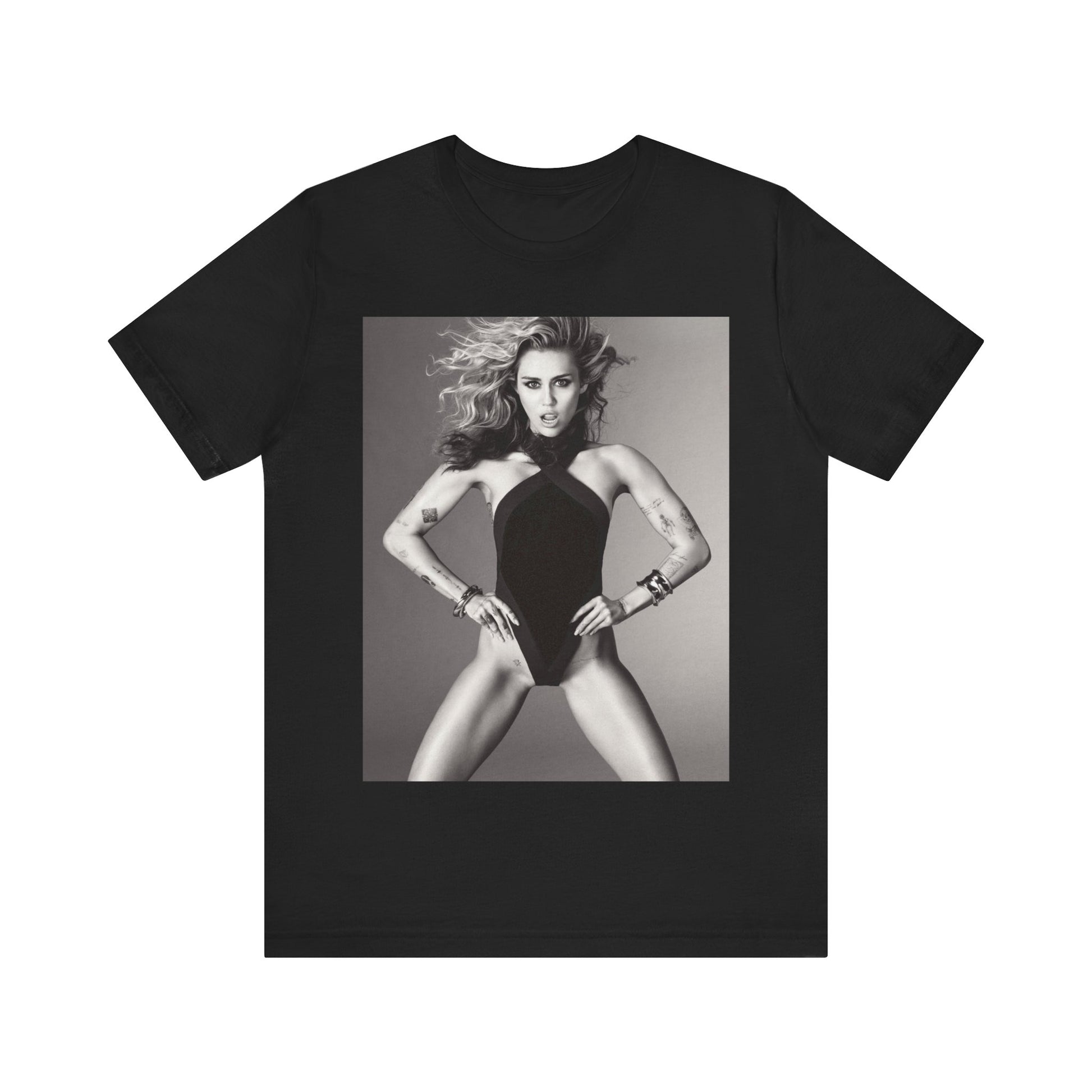 A black graphic t-shirt featuring a bold graphic of Miley Cyrus as a pop superstar.