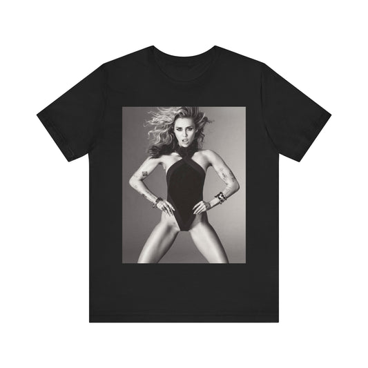 A black graphic t-shirt featuring a bold graphic of Miley Cyrus as a pop superstar.