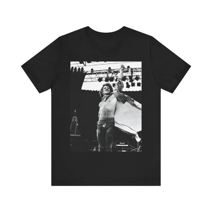 A black graphic t-shirt featuring an epic arena rock graphic of Bon Jovi performing on a large stage.